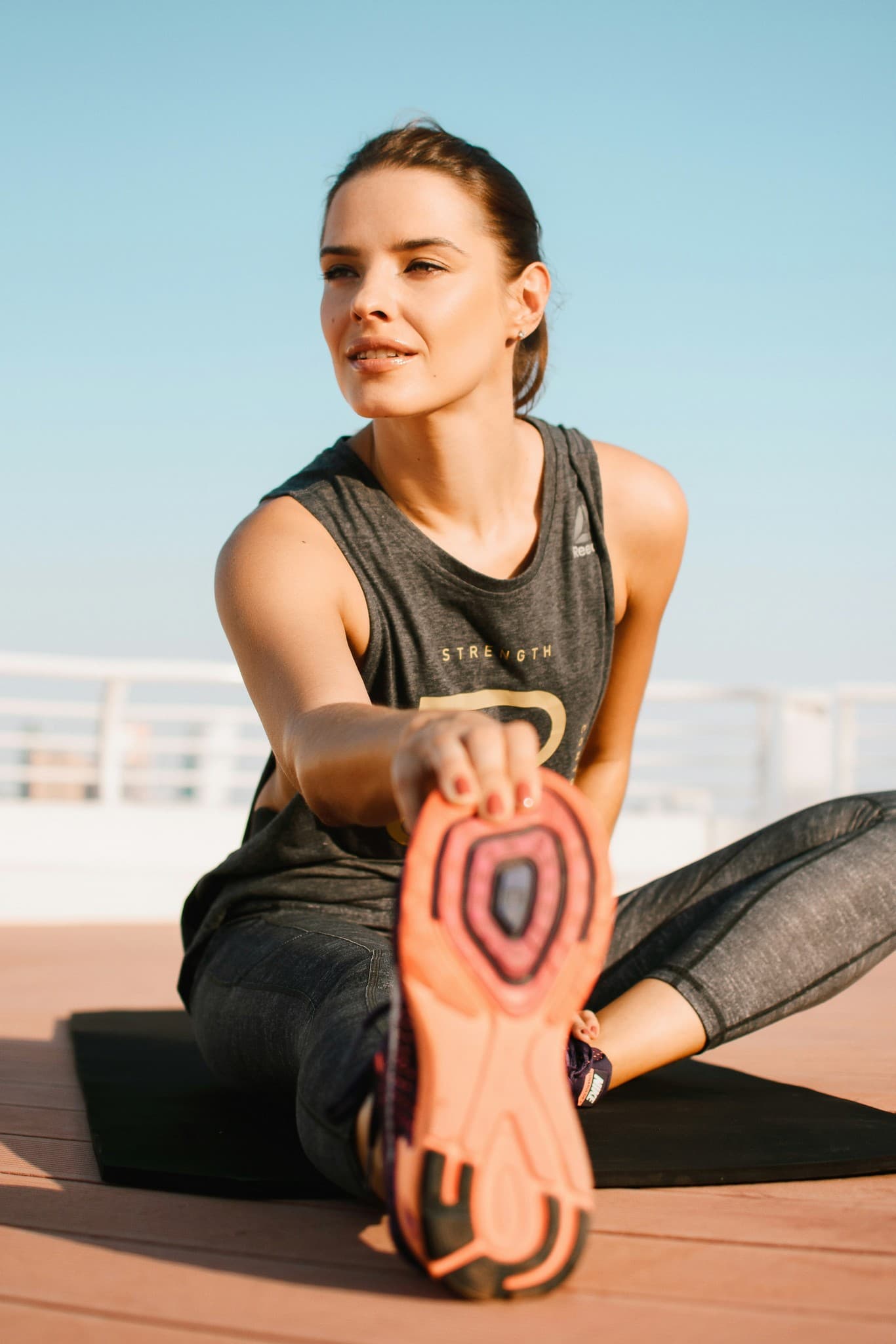 Woman stretching outdoors in the sun